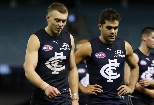 Patrick Cripps and Jack Martin of the Blues look dejected after a loss during the 2021 AFL Round 19 match between the Carlton Blues and the North...
