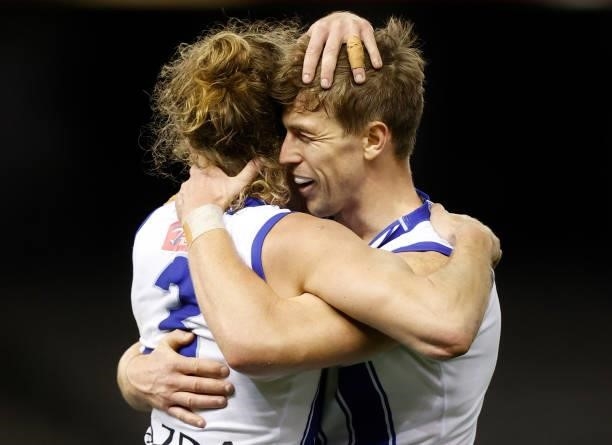 Jed Anderson and Trent Dumont of the Kangaroos celebrate during the 2021 AFL Round 19 match between the Carlton Blues and the North Melbourne...