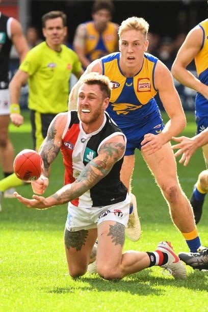 Tim Membrey of the Saints handpasses the ball during the 2021 AFL Round 19 match between the West Coast Eagles and the St Kilda Saints at Optus...