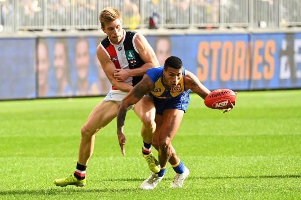 Tim Kelly of the Eagles competes for the ball with Sebastian Ross of the Saints during the 2021 AFL Round 19 match between the West Coast Eagles and...