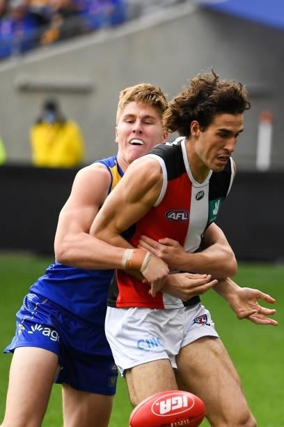 Max King of the Saints is tackled by Harry Edwards of the Eagles during the 2021 AFL Round 19 match between the West Coast Eagles and the St Kilda...