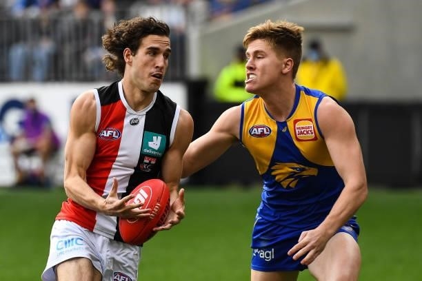 Max King of the Saints looks to break past Harry Edwards of the Eagles during the 2021 AFL Round 19 match between the West Coast Eagles and the St...