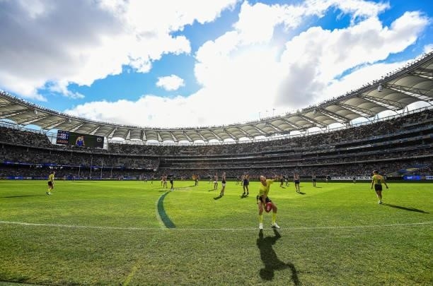 The umpire throws the ball in from the boundary during the 2021 AFL Round 19 match between the West Coast Eagles and the St Kilda Saints at Optus...