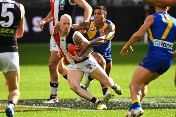 Zak Jones of the Saints is tackled by Tim Kelly of the Eagles during the 2021 AFL Round 19 match between the West Coast Eagles and the St Kilda...