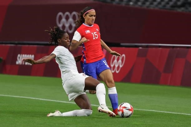 Canada's defender Kadeisha Buchanan tackles Chile's forward Daniela Zamora during the Tokyo 2020 Olympic Games women's group E first round football...