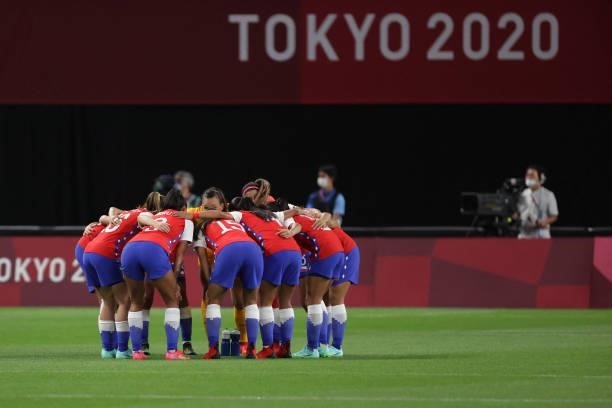 Chile players gather in a huddle before the start of the Tokyo 2020 Olympic Games women's group E first round football match between Chile and Canada...