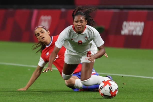 Canada's defender Jayde Riviere is tackled by Chile's forward Daniela Zamora during the Tokyo 2020 Olympic Games women's group E first round football...