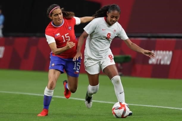 Chile's forward Daniela Zamora fights for the ball with Canada's defender Jayde Riviere during the Tokyo 2020 Olympic Games women's group E first...