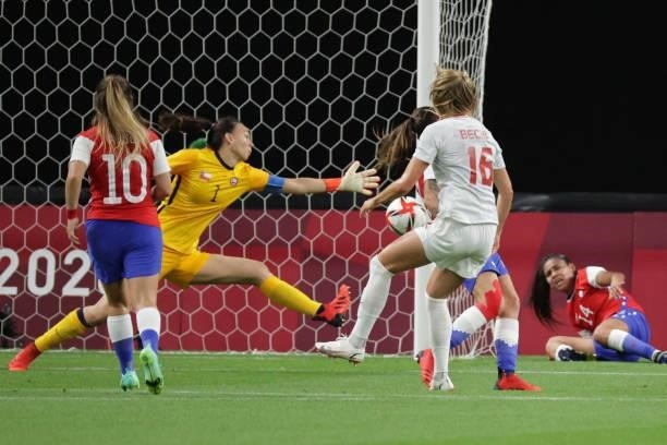 Canada's forward Janine Beckie shoots and scores her team's first goal during the Tokyo 2020 Olympic Games women's group E first round football match...