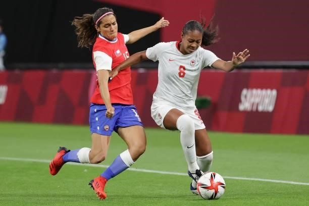 Chile's forward Daniela Zamora fights for the ball with Canada's defender Jayde Riviere during the Tokyo 2020 Olympic Games women's group E first...