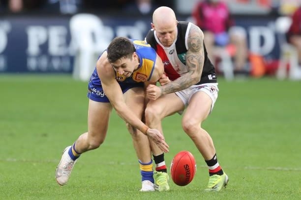 Xavier O'Neill of the Eagles is bumped by Zak Jones of the Saints during the 2021 AFL Round 19 match between the West Coast Eagles and the St Kilda...