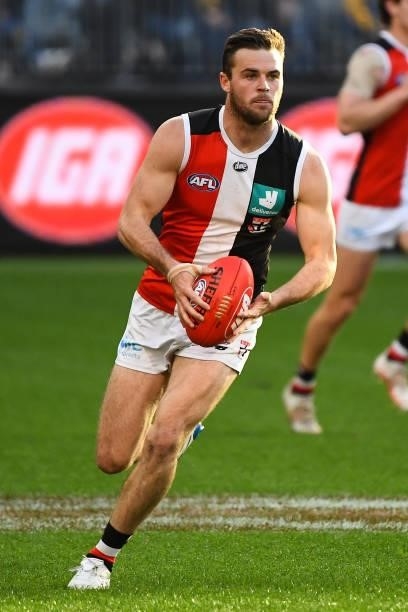 Brad Crouch of the Saints runs with the ball during the 2021 AFL Round 19 match between the West Coast Eagles and the St Kilda Saints at Optus...