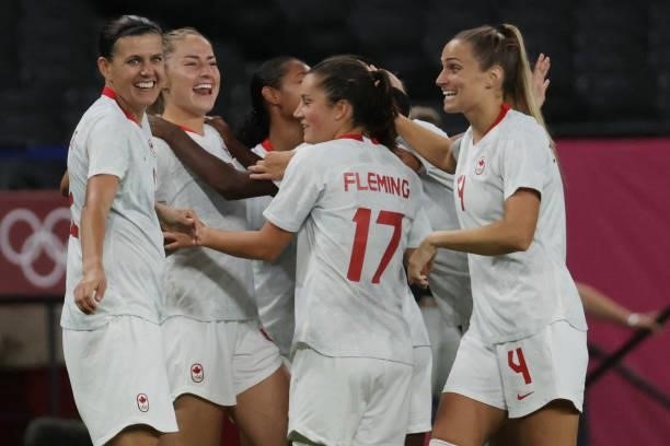 Cananda players celebrate their team's second goal during the Tokyo 2020 Olympic Games women's group E first round football match between Chile and...