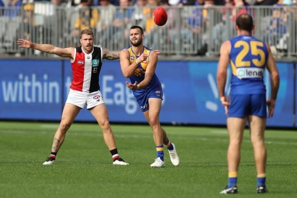 Josh Rotham of the Eagles handpasses the ball during the 2021 AFL Round 19 match between the West Coast Eagles and the St Kilda Saints at Optus...