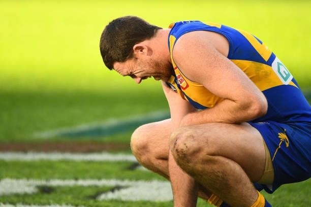 Jeremy McGovern of the Eagles sits in pain during the 2021 AFL Round 19 match between the West Coast Eagles and the St Kilda Saints at Optus Stadium...
