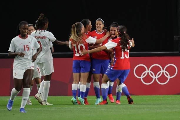 Chile's midfielder Karen Araya celebrates with teammates after scoring her team's first goal during the Tokyo 2020 Olympic Games women's group E...