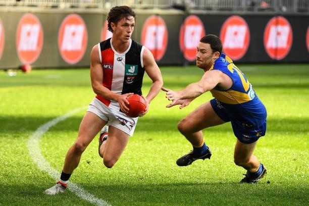 Leo Connolly of the Saints runs with the ball during the 2021 AFL Round 19 match between the West Coast Eagles and the St Kilda Saints at Optus...