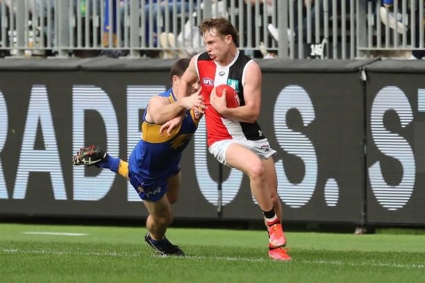 Ryan Byrnes of the Saints evades Jeremy McGovern of the Eagles during the 2021 AFL Round 19 match between the West Coast Eagles and the St Kilda...