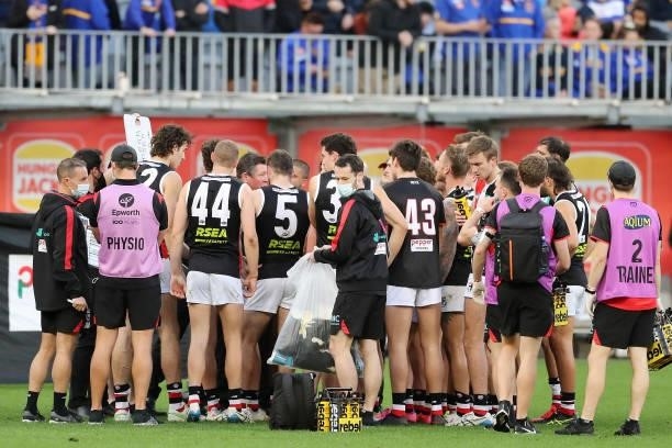 Brett Ratten, Senior Coach of the Saints addresses the team at three quarter time break during the 2021 AFL Round 19 match between the West Coast...