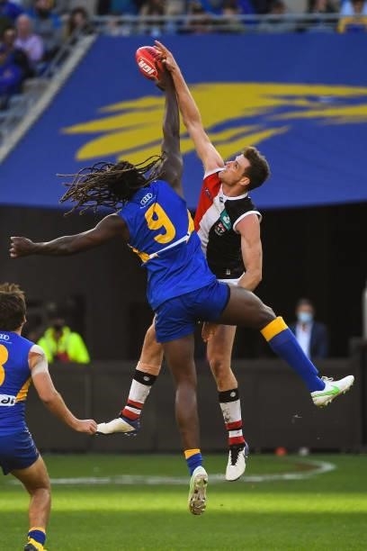 Nic Naitanui of the Eagles competes in a ruck contest with Paul Hunter of the Saints during the 2021 AFL Round 19 match between the West Coast Eagles...