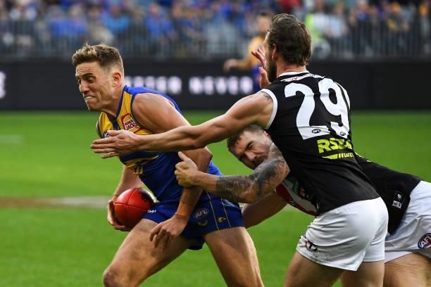 Brad Sheppard of the Eagles is tackled by Dean Kent of the Saints during the 2021 AFL Round 19 match between the West Coast Eagles and the St Kilda...
