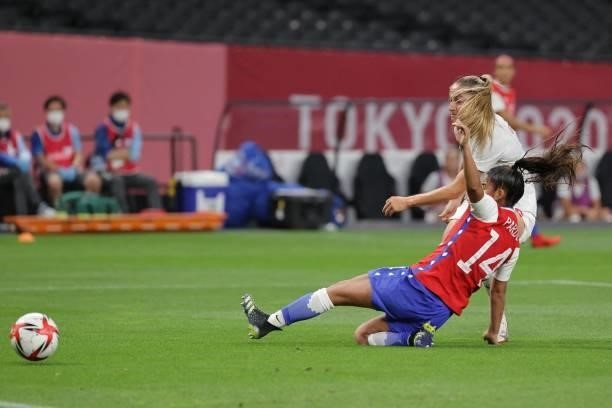 Canada's forward Janine Beckie is tackled by Chile's defender Daniela Pardo during the Tokyo 2020 Olympic Games women's group E first round football...