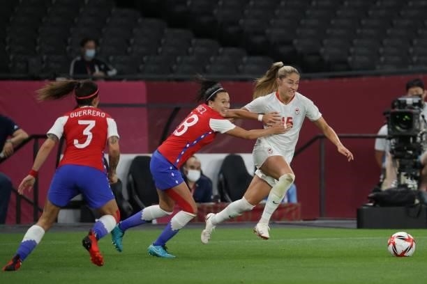 Canada's forward Janine Beckie fights for the ball with Chile's forward Rosario Balmaceda during the Tokyo 2020 Olympic Games women's group E first...