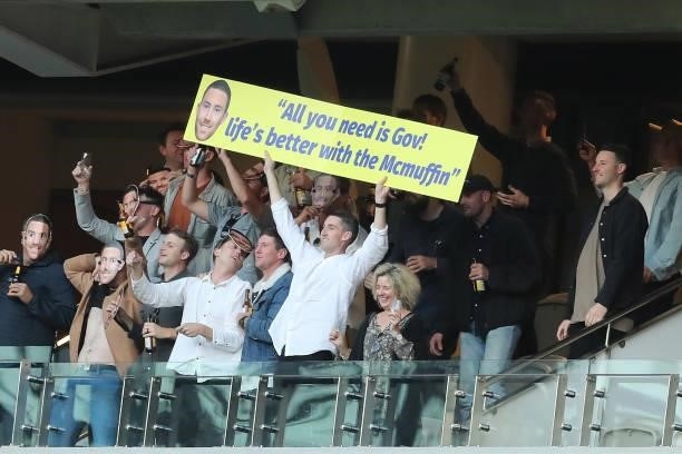 Fans hold up a placard for Jeremy McGovern after playing his 150th game during the 2021 AFL Round 19 match between the West Coast Eagles and the St...