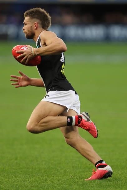 Dan Butler of the Saints runs with the ball during the 2021 AFL Round 19 match between the West Coast Eagles and the St Kilda Saints at Optus Stadium...