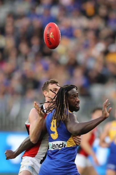 Paul Hunter of the Saints contests a ruck with Nic Naitanui of the Eagles during the 2021 AFL Round 19 match between the West Coast Eagles and the St...