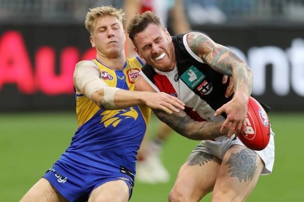 Tim Membrey of the Saints is tackled by Oscar Allen of the Eagles during the 2021 AFL Round 19 match between the West Coast Eagles and the St Kilda...