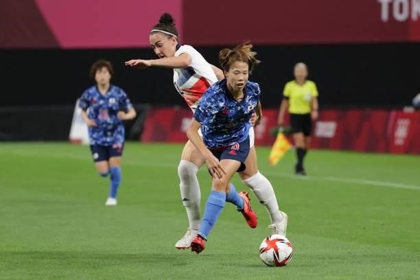 Japan's midfielder Hina Sugita fights for the ball with Britain's defender Lucy Bronze during the Tokyo 2020 Olympic Games women's group E first...
