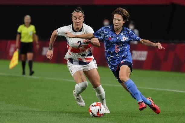 Japan's midfielder Hina Sugita vies with Britain's defender Lucy Bronze during the Tokyo 2020 Olympic Games women's group E first round football...