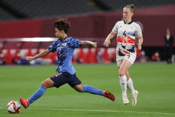 Japan's forward Mina Tanaka shoots and fails to score during the Tokyo 2020 Olympic Games women's group E first round football match between Japan...