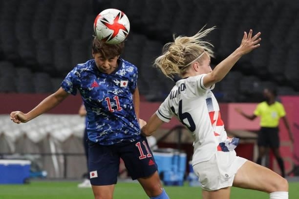 Japan's forward Mina Tanaka heads the ball during the Tokyo 2020 Olympic Games women's group E first round football match between Japan and Britain...