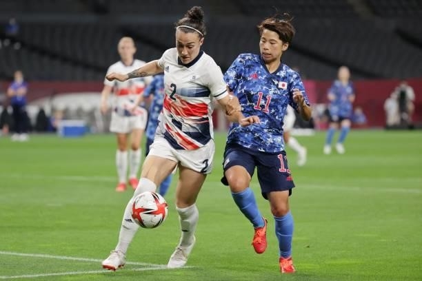 Britain's defender Lucy Bronze fights for the ball with Japan's forward Mina Tanaka during the Tokyo 2020 Olympic Games women's group E first round...