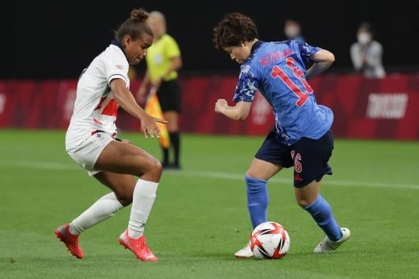 Japan's defender Asato Miyagawa fights for the ball Britain's forward Nikita Parris during the Tokyo 2020 Olympic Games women's group E first round...