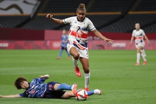Britain's forward Nikita Parris is tackled by Japan's defender Asato Miyagawa during the Tokyo 2020 Olympic Games women's group E first round...