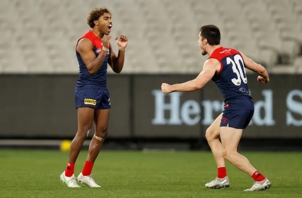 Kysaiah Pickett and Alex Neal-Bullen of the Demons compete for the ball during the 2021 AFL Round 19 match between the Melbourne Demons and the...