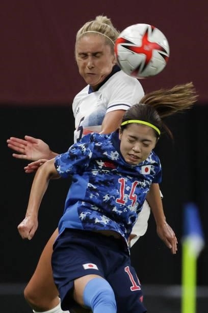 Japan's midfielder Yui Hasegawa vies with Britain's defender Steph Houghton during the Tokyo 2020 Olympic Games women's group E first round football...