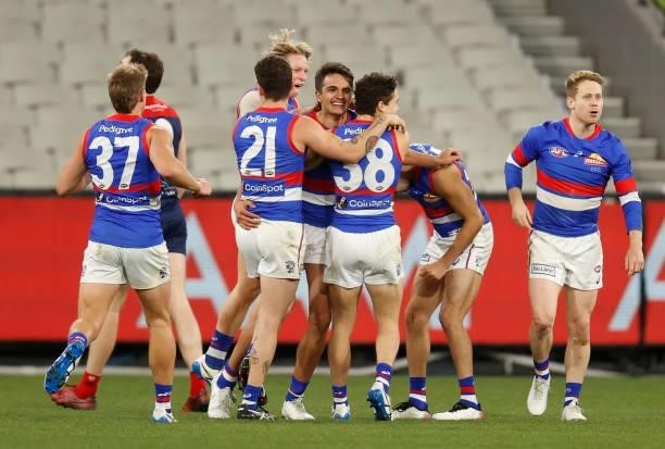 Jamarra Ugle-Hagan of the Bulldogs celebrates a goal with teammates during the 2021 AFL Round 19 match between the Melbourne Demons and the Western...