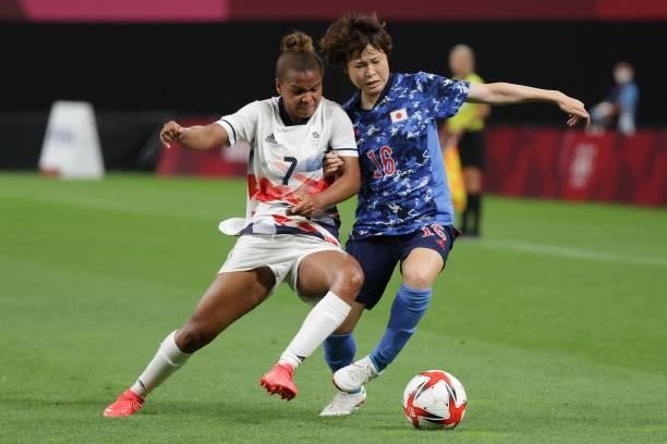 Japan's defender Asato Miyagawa fights for the ball Britain's forward Nikita Parris during the Tokyo 2020 Olympic Games women's group E first round...