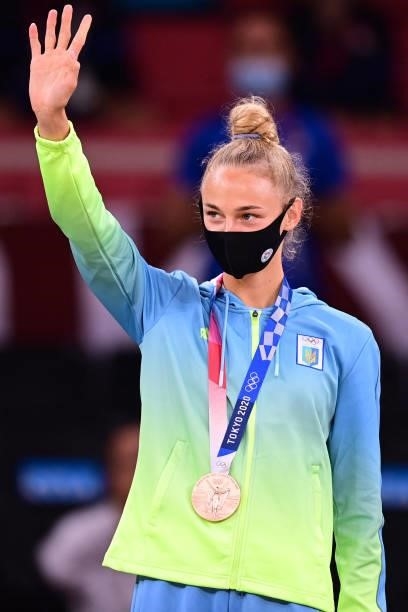 Bronze medallist Ukraine's Daria Bilodid celebrates during the medal ceremony for the judo women's -48kg contest during the Tokyo 2020 Olympic Games...