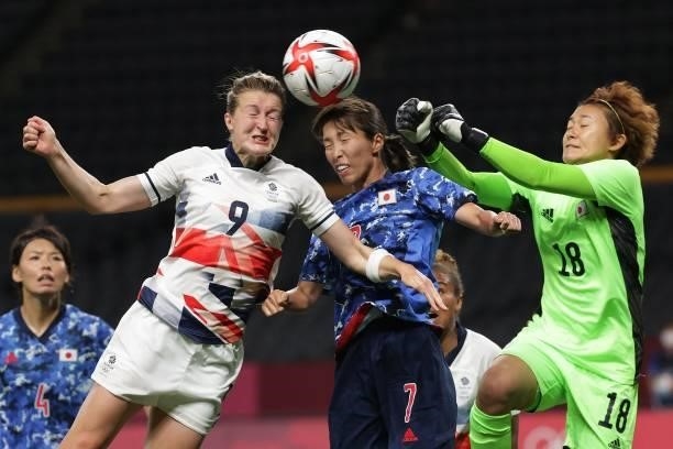 Britain's forward Ellen White heads the ball to score a goal during the Tokyo 2020 Olympic Games women's group E first round football match between...