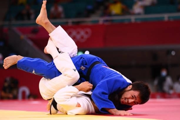 Netherlands' Tornike Tsjakadoea competes with Kazakhstan's Yeldos Smetov during their judo men's -60kg bronze medal A bout during the Tokyo 2020...