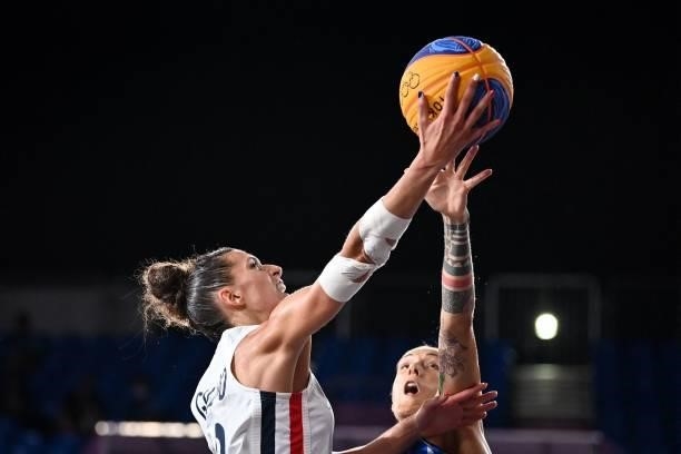 France's Laetitia Guapo fights for the ball with Italy's Marcella Filippi during the women's first round 3x3 basketball match between France and...