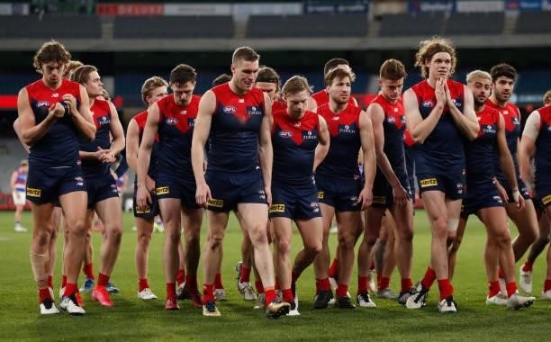The Demons look dejected after a loss during the 2021 AFL Round 19 match between the Melbourne Demons and the Western Bulldogs at the Melbourne...
