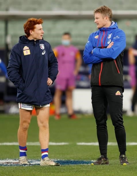 Ed Richards and Alex Keath of the Bulldogs look on during the 2021 AFL Round 19 match between the Melbourne Demons and the Western Bulldogs at the...