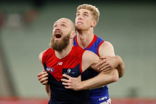 Tim English of the Bulldogs and Max Gawn of the Demons compete for the ball during the 2021 AFL Round 19 match between the Melbourne Demons and the...