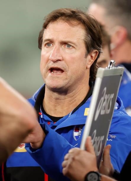 Luke Beveridge, Senior Coach of the Bulldogs addresses his players \during the 2021 AFL Round 19 match between the Melbourne Demons and the Western...